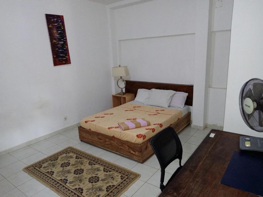 Postel nebo postele na pokoji v ubytování Casa Cacheu Homestay Guest House