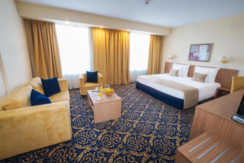 Postel nebo postele na pokoji v ubytování Hotel Monogram Park