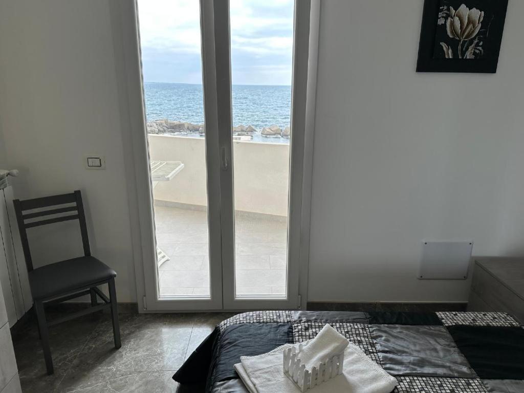 Postel nebo postele na pokoji v ubytování Orizzonte Flat