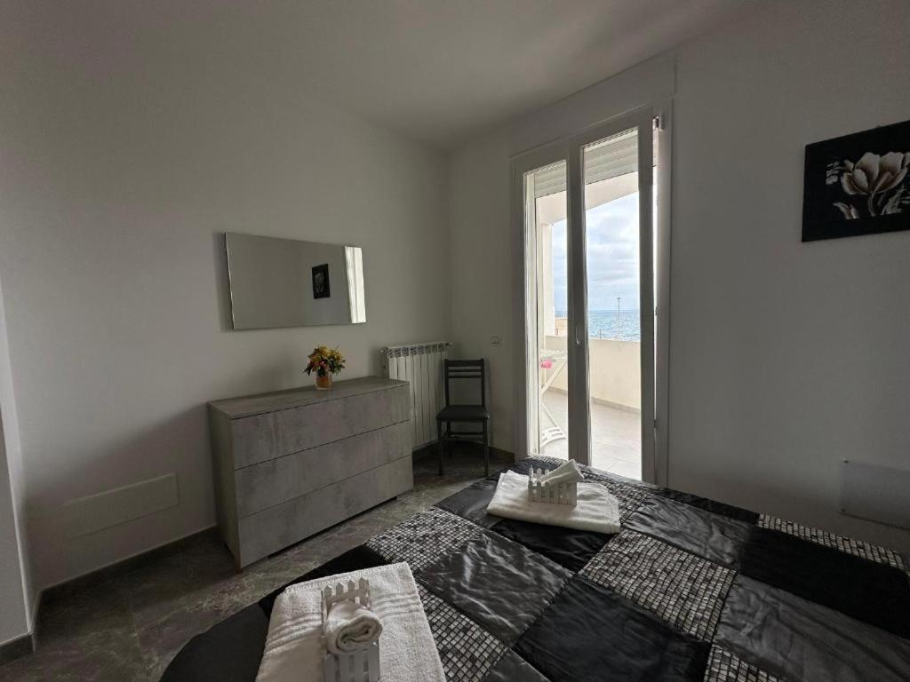 Postel nebo postele na pokoji v ubytování Orizzonte Flat