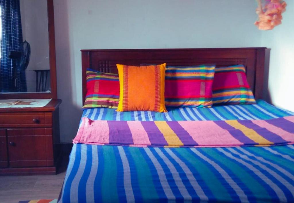 Postel nebo postele na pokoji v ubytování Q3 Homestay