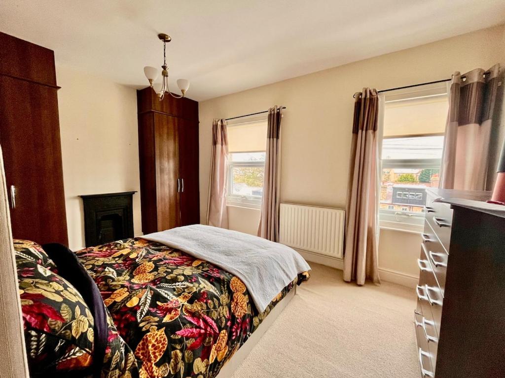 a bedroom with a bed and a fireplace at 2 bedroom Hidden Gem in Stamford with parking in Stamford
