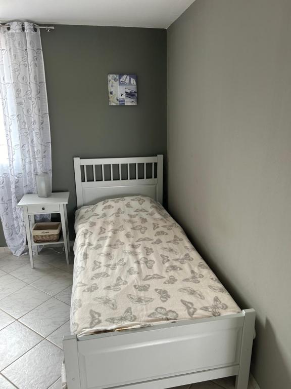 Łóżko lub łóżka w pokoju w obiekcie Apartmani Starcevic