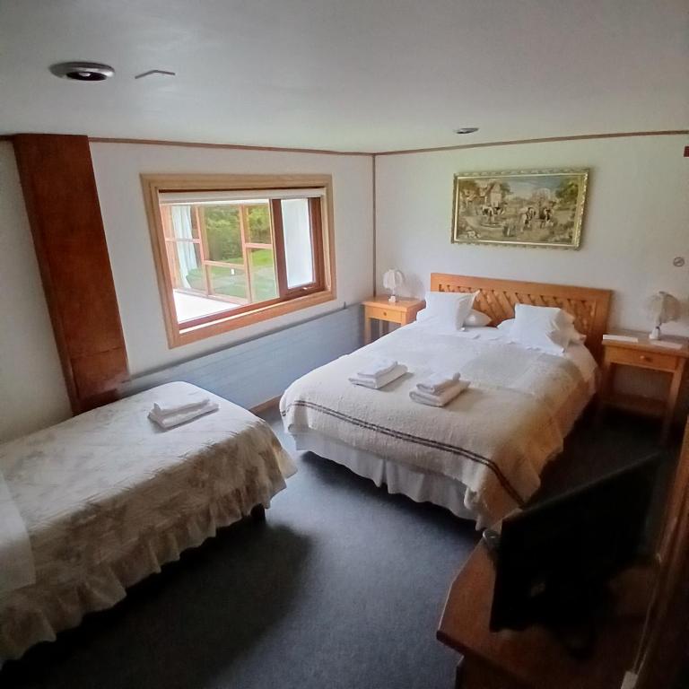 Postel nebo postele na pokoji v ubytování Hotel Mi Casa