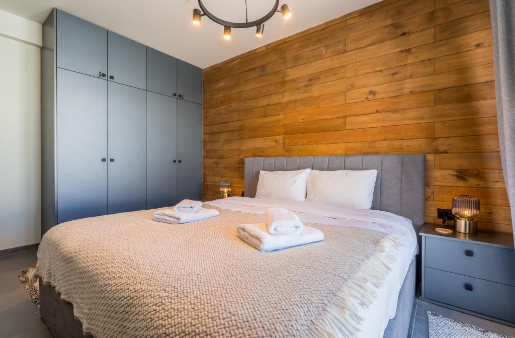 Postel nebo postele na pokoji v ubytování New Gudauri Apartments