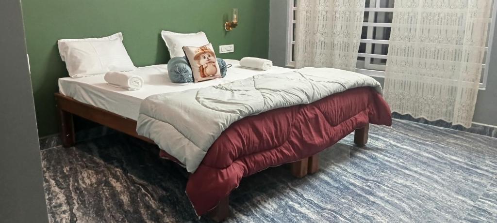 Postel nebo postele na pokoji v ubytování Budha Home Stay