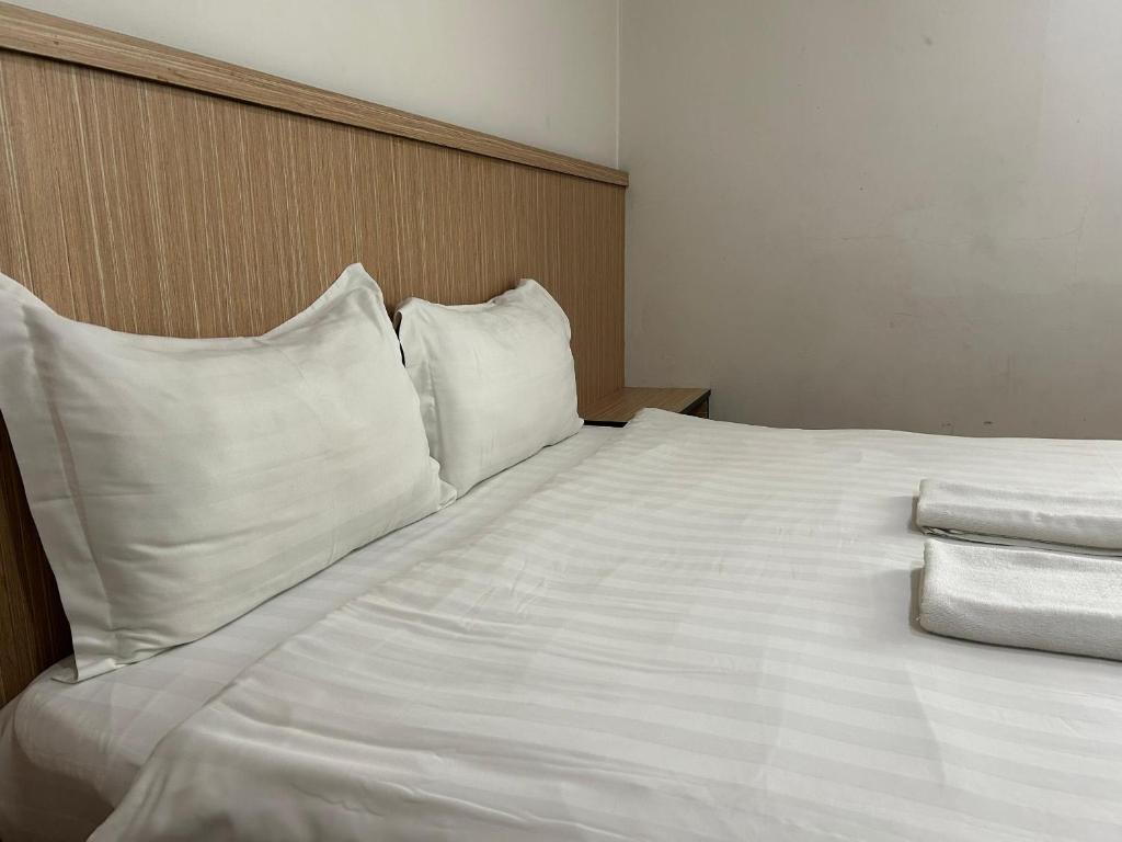 Postel nebo postele na pokoji v ubytování Mint Hotel