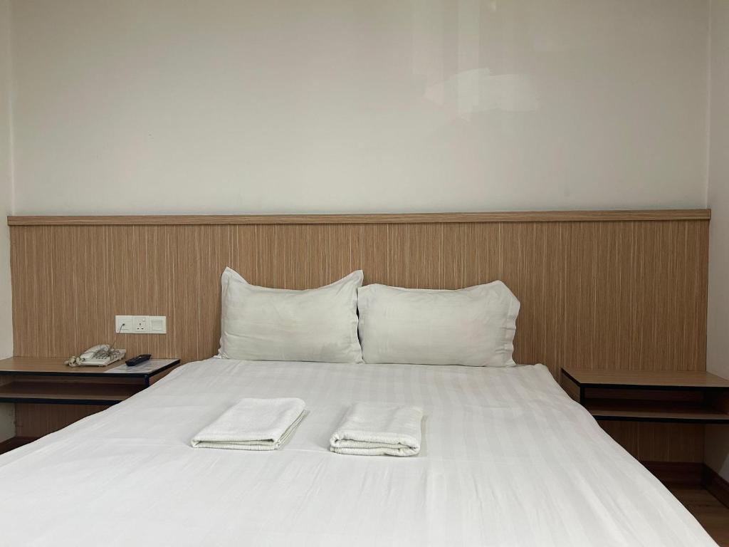 Postel nebo postele na pokoji v ubytování Mint Hotel