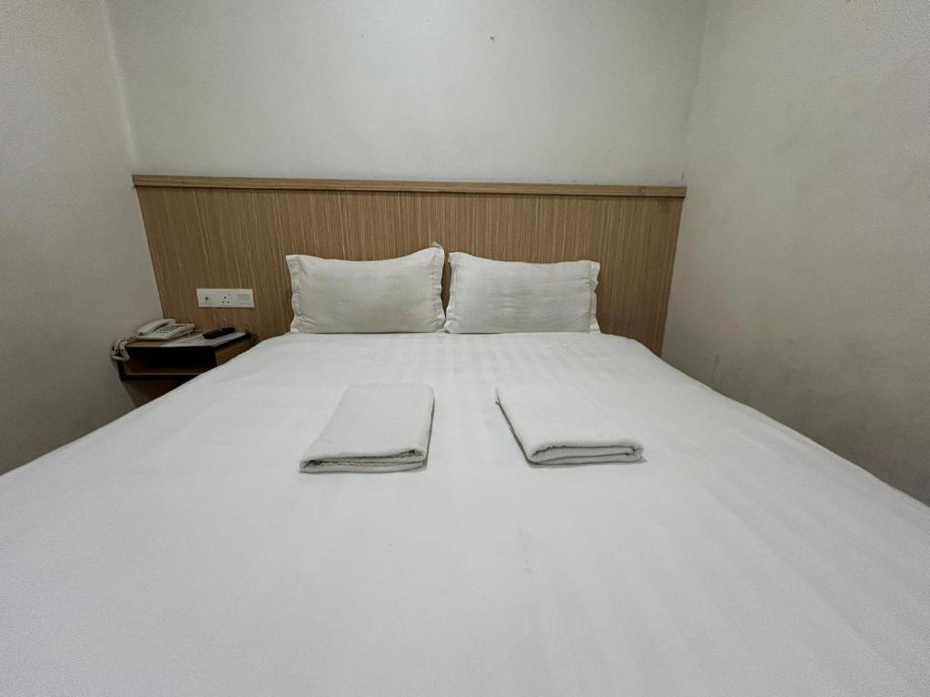 Postel nebo postele na pokoji v ubytování Mint Hotel