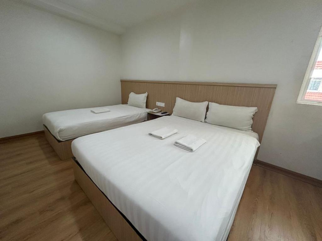 Postel nebo postele na pokoji v ubytování Mint Hotel