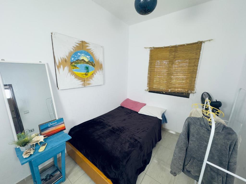 Postel nebo postele na pokoji v ubytování kotob house