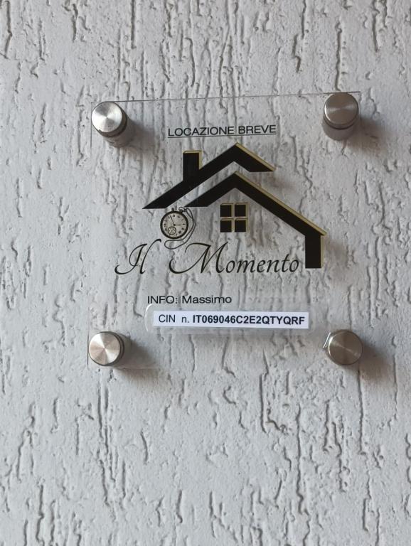 a sign on the side of a building with a monongahela at Il Momento in Lanciano