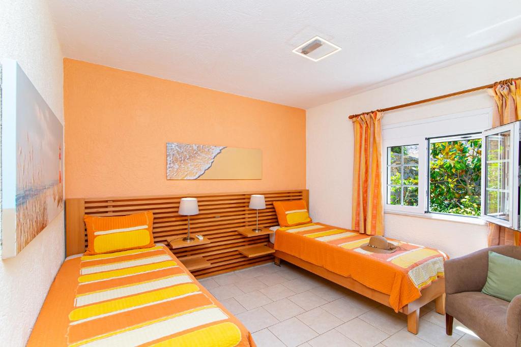 Postel nebo postele na pokoji v ubytování Sissi Hills Villa