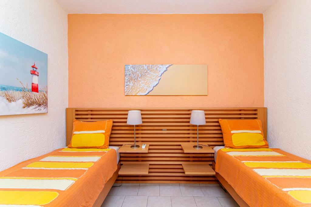 Postel nebo postele na pokoji v ubytování Sissi Hills Villa