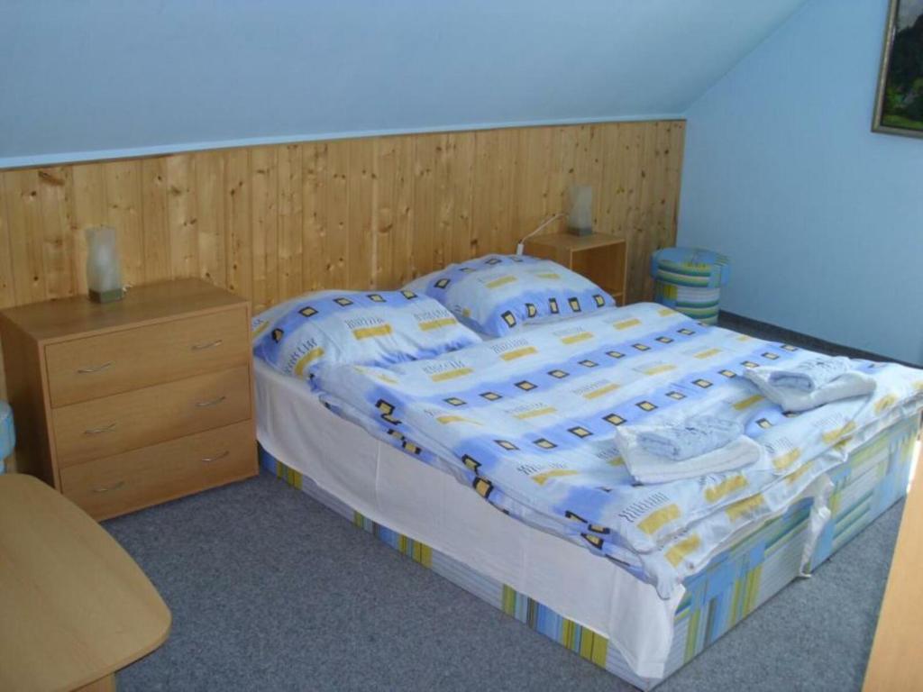 Postel nebo postele na pokoji v ubytování Penzion U Kocoura