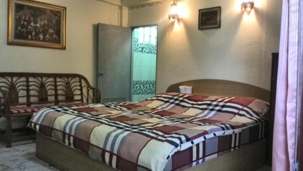 Postel nebo postele na pokoji v ubytování Tientong Guesthouse