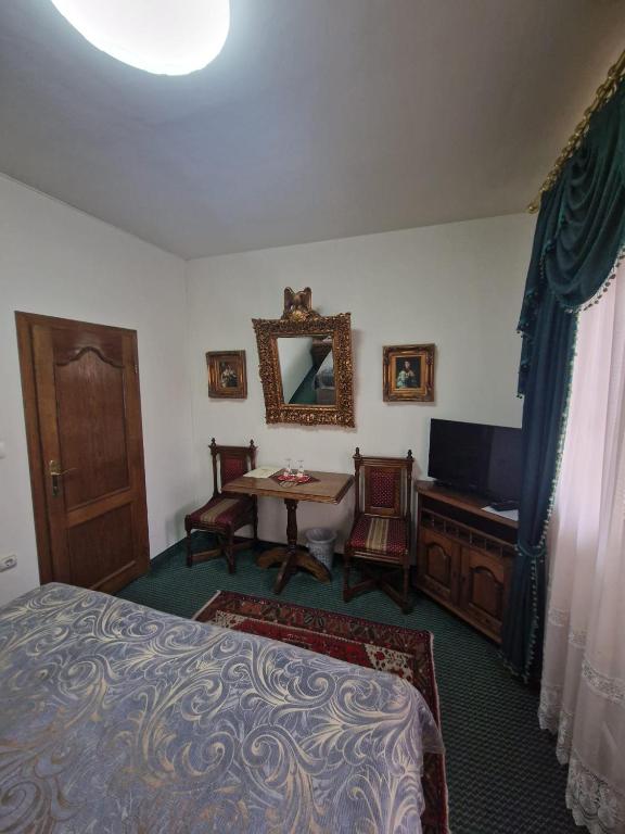 Postel nebo postele na pokoji v ubytování Hotel Razgorsek