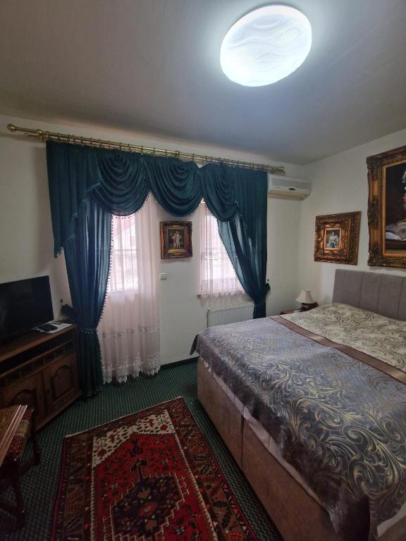 Postel nebo postele na pokoji v ubytování Hotel Razgorsek