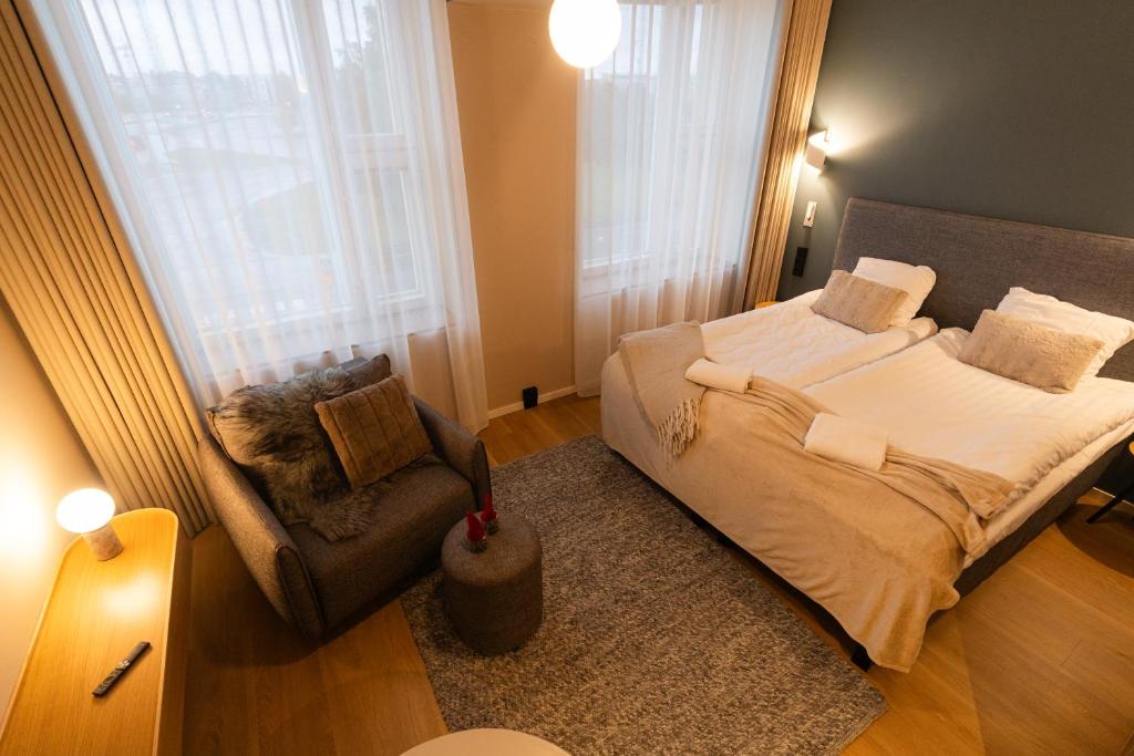 Vuode tai vuoteita majoituspaikassa Postmaster Hotel