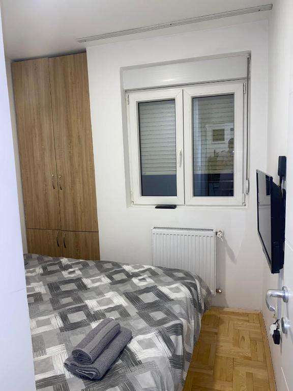 Postel nebo postele na pokoji v ubytování Apartman Filip