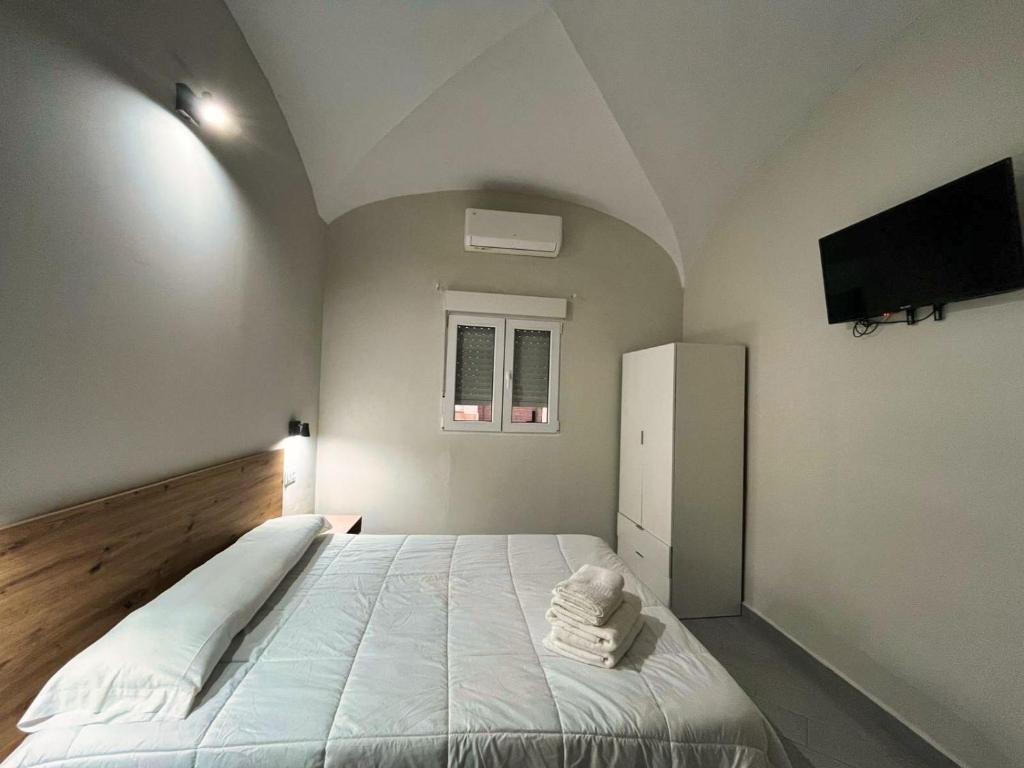 Postel nebo postele na pokoji v ubytování Hostal Pompeya Merida