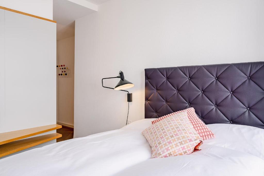 Postel nebo postele na pokoji v ubytování Consum Boutique Hotel