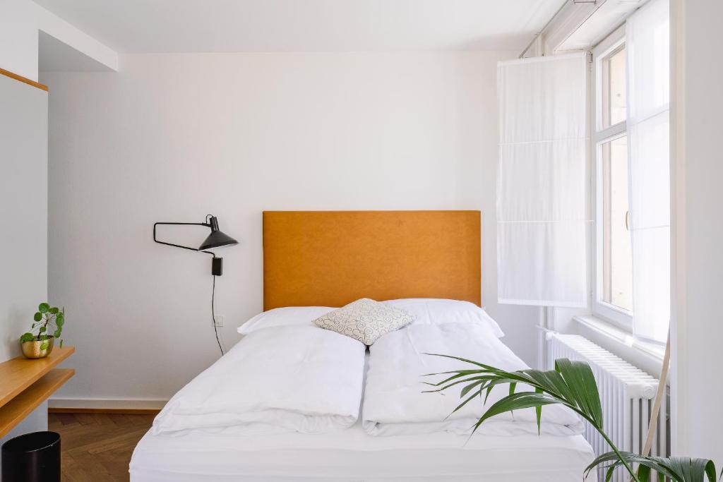 Postel nebo postele na pokoji v ubytování Consum Boutique Hotel