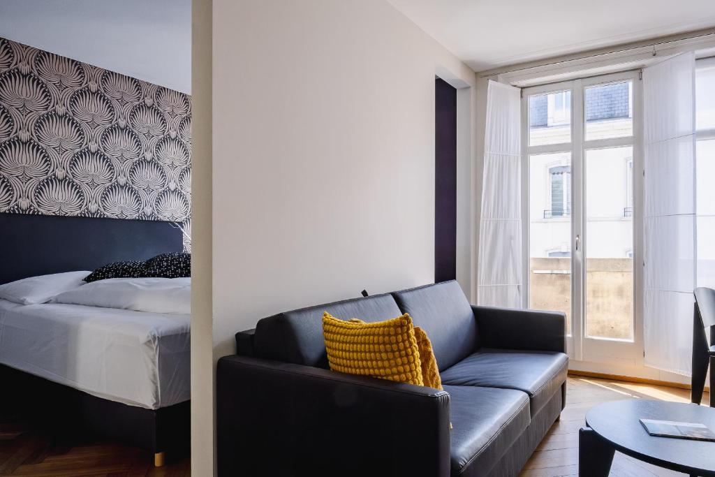 Postel nebo postele na pokoji v ubytování Consum Boutique Hotel