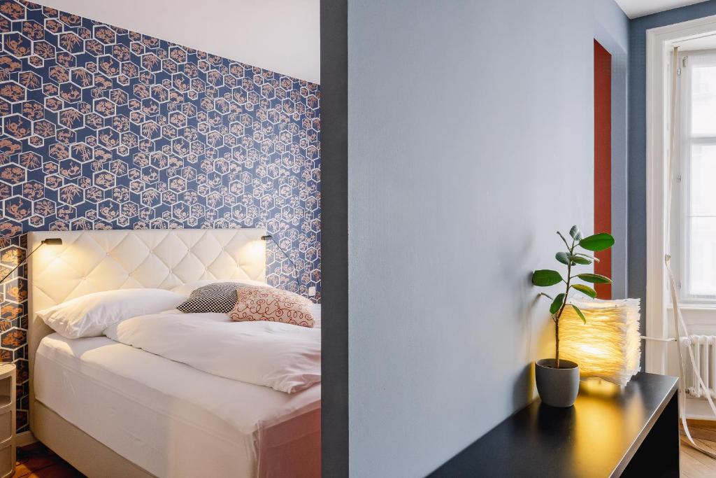 Postel nebo postele na pokoji v ubytování Consum Boutique Hotel
