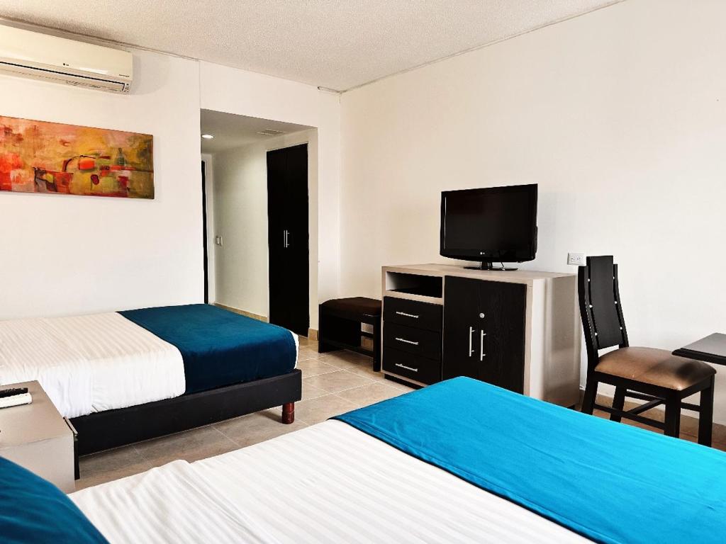 Postel nebo postele na pokoji v ubytování Hotel Tonchalá