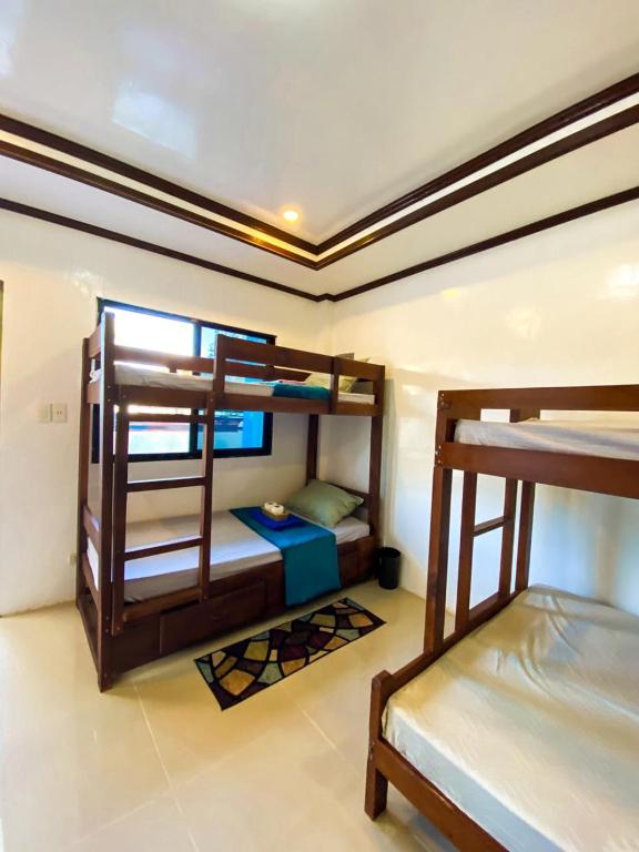 Postel nebo postele na pokoji v ubytování Hapitanan Hostel Siargao
