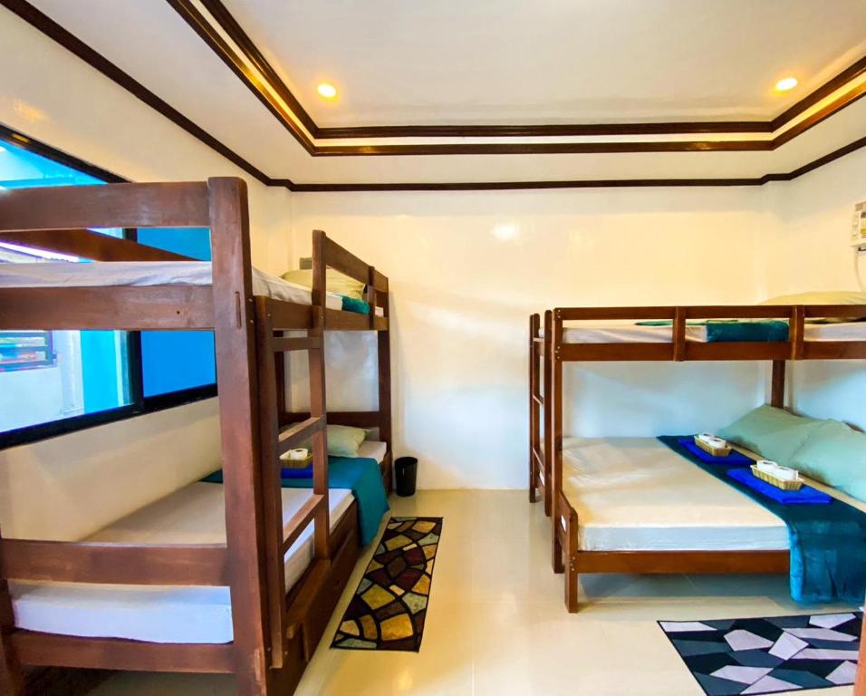 Postel nebo postele na pokoji v ubytování Hapitanan Hostel Siargao