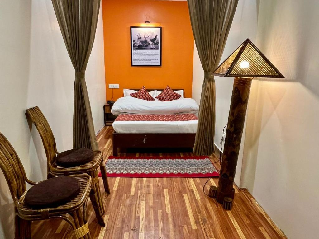 Postel nebo postele na pokoji v ubytování Gorkha Heritage Home