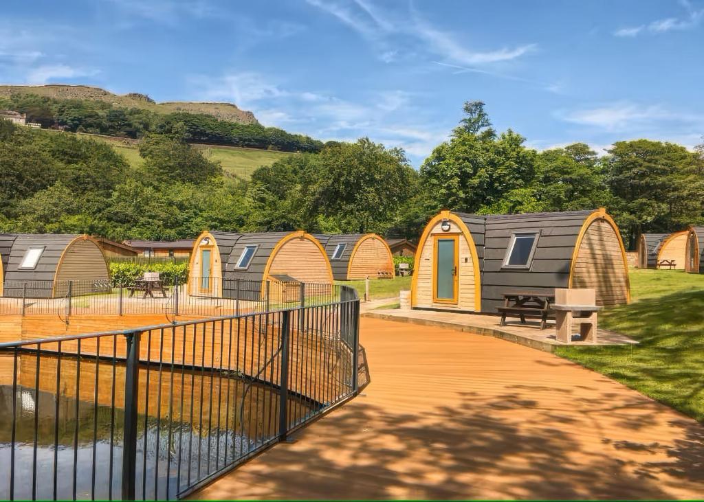 a row of tiny houses in a park at Lakeside Pods - pets welcome in Oldham
