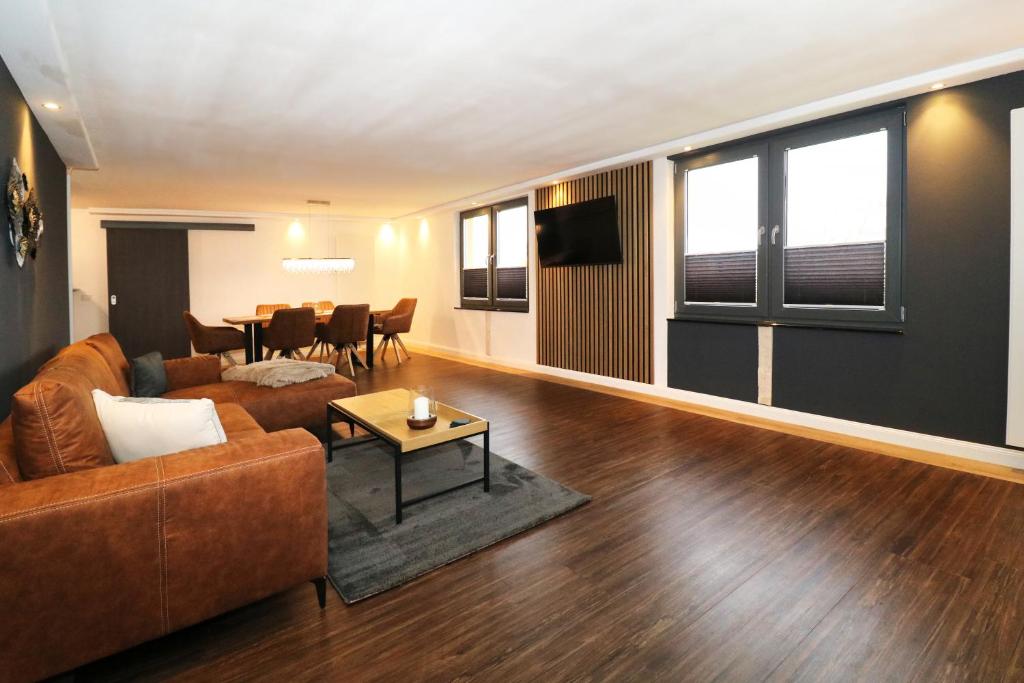 a living room with a couch and a table at Ferienwohnung 5 in Zemitz