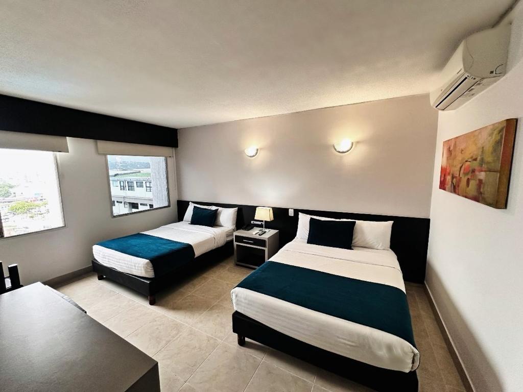 Postel nebo postele na pokoji v ubytování Hotel Tonchalá