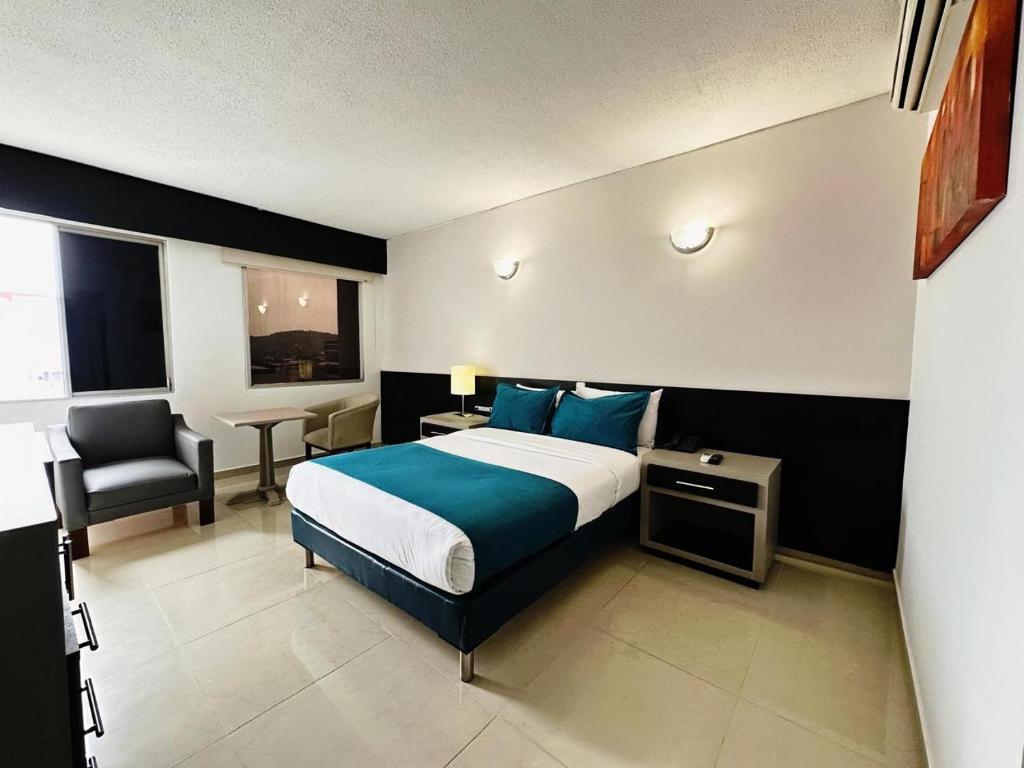 Postel nebo postele na pokoji v ubytování Hotel Tonchalá