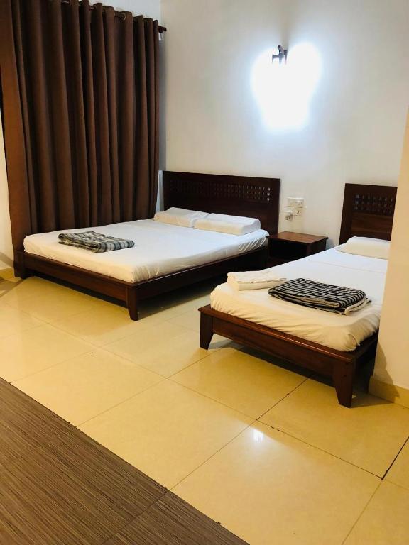 Postel nebo postele na pokoji v ubytování Lafala Hotel & Service Apartment