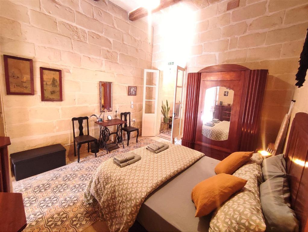 Postel nebo postele na pokoji v ubytování OnTheRocks - Holiday Home in Victoria, Gozo