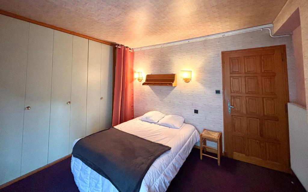 Posteľ alebo postele v izbe v ubytovaní L'AIGLON appartement