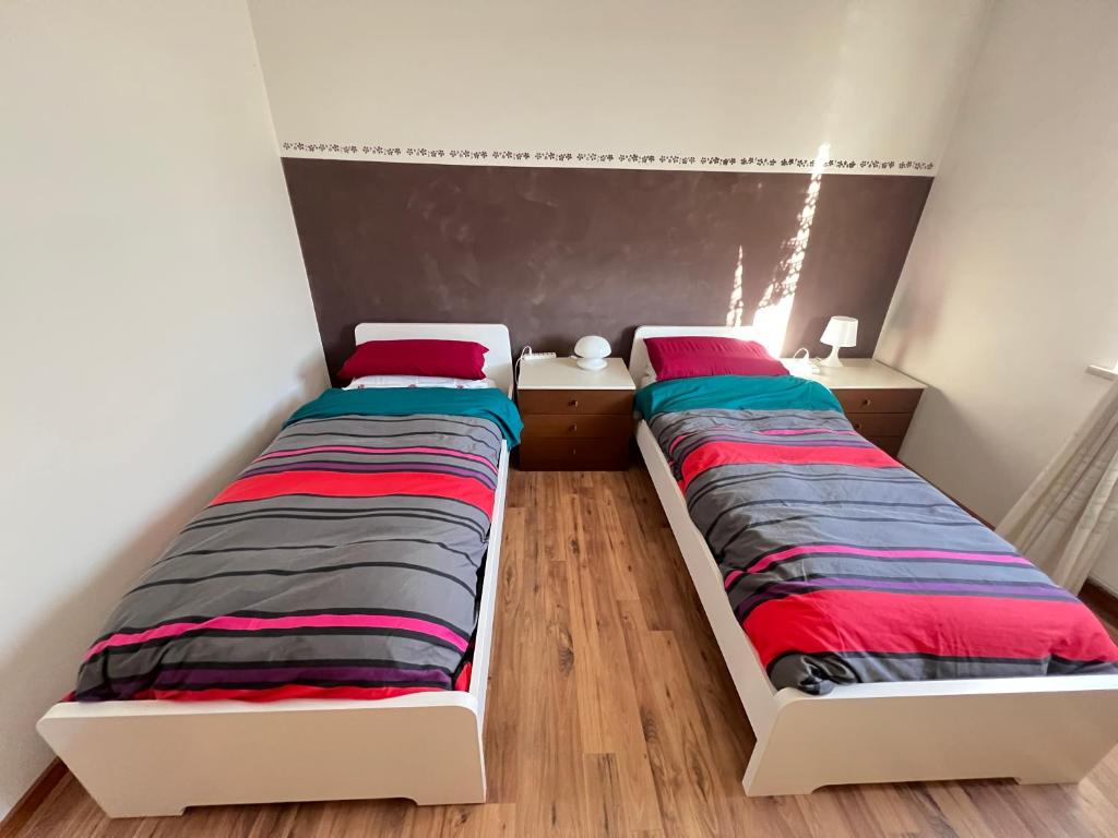 Postel nebo postele na pokoji v ubytování Villa Gianfranca - sentiti come a casa