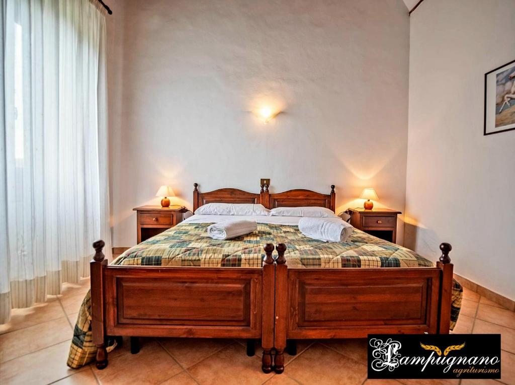 Postel nebo postele na pokoji v ubytování Agriturismo Lampugnano