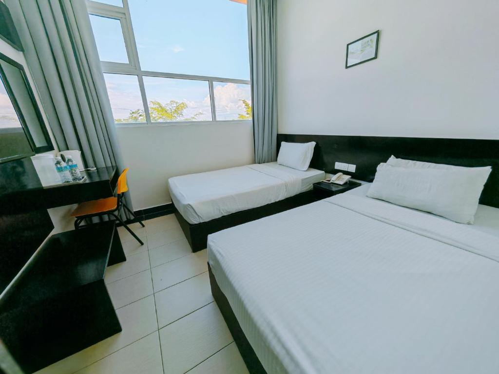 Postel nebo postele na pokoji v ubytování Citrine Hotel