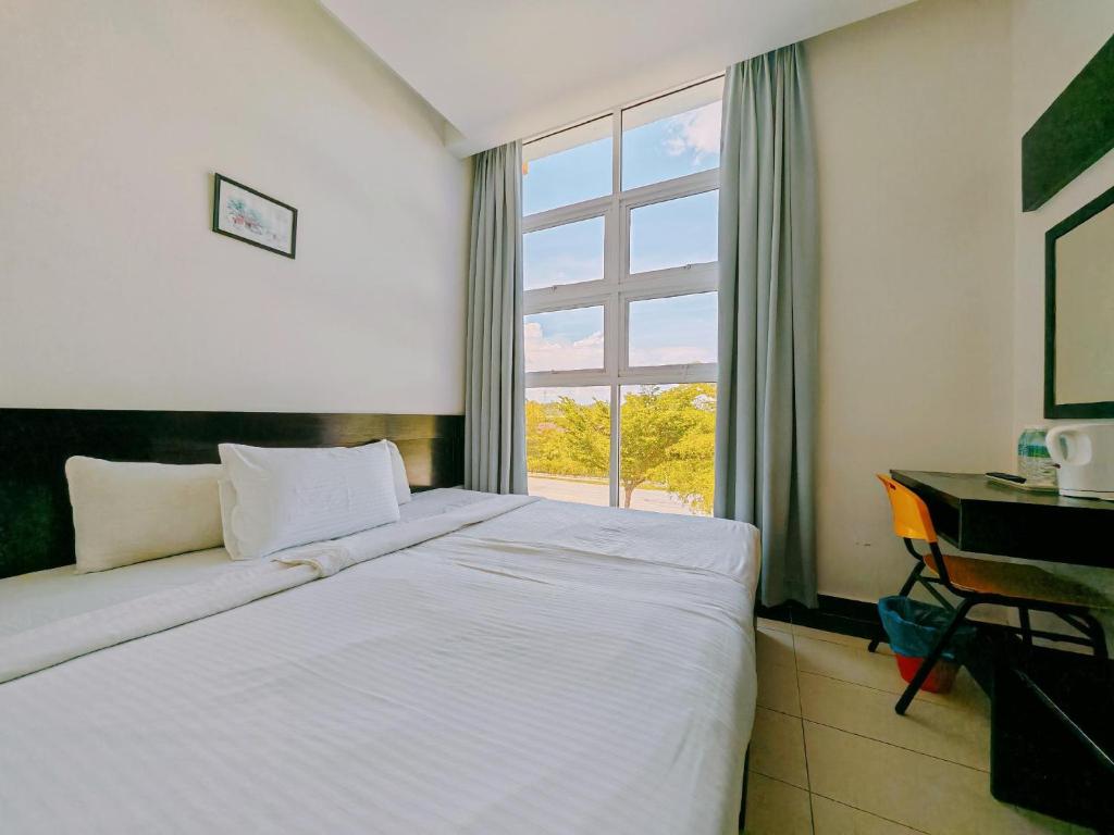 Postel nebo postele na pokoji v ubytování Citrine Hotel