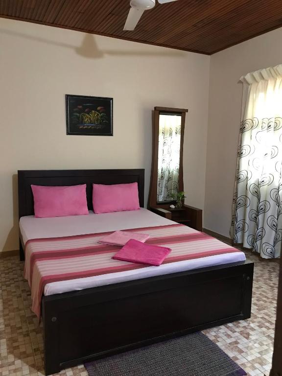 Llit o llits en una habitació de Villa Rodrigo Lite