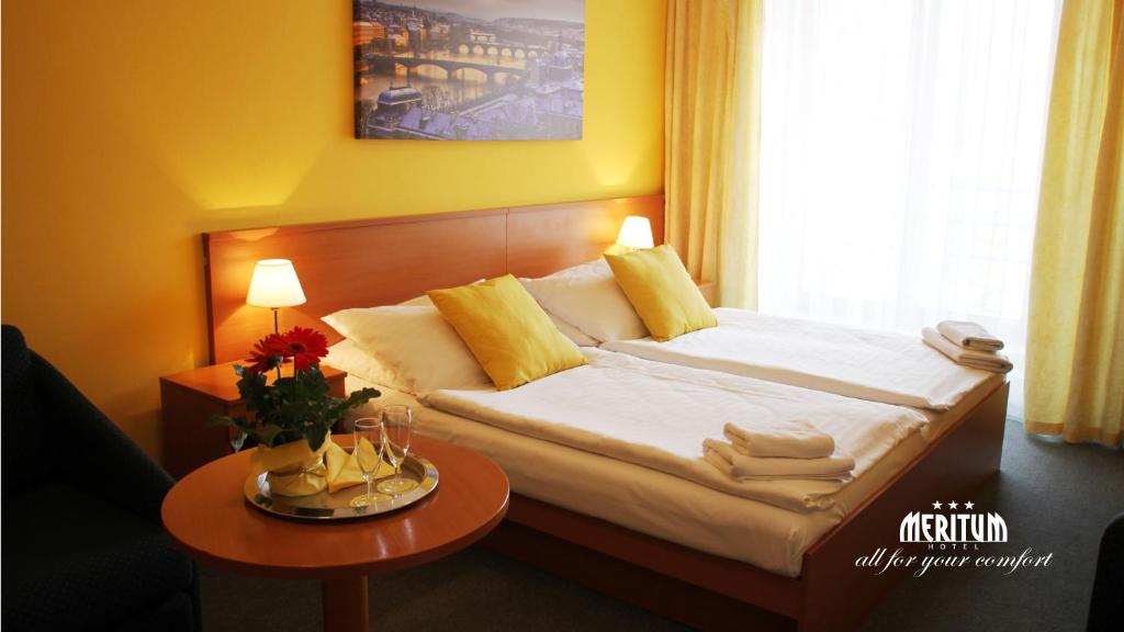 Postel nebo postele na pokoji v ubytování Hotel Meritum