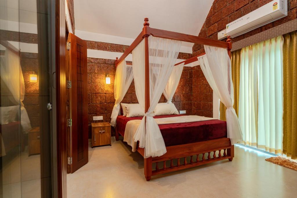 Postel nebo postele na pokoji v ubytování Misty Forest Resort Wayanad