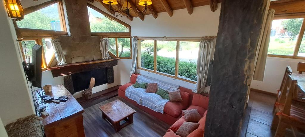 a living room with a couch and a fireplace at Casa Nico in San Carlos de Bariloche