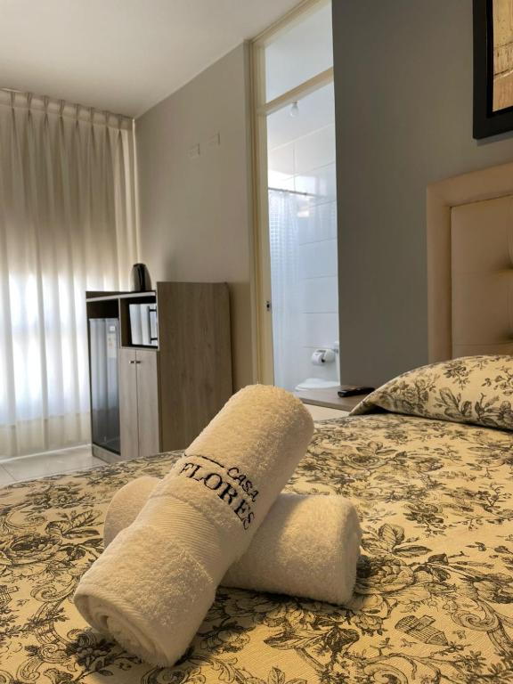 Postel nebo postele na pokoji v ubytování Casa Las Flores Ica