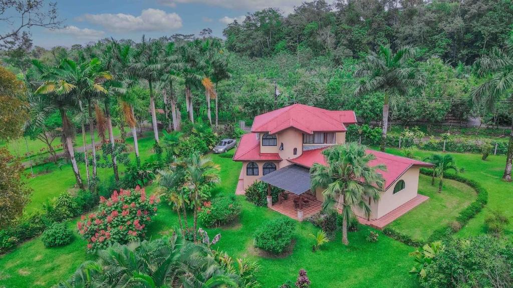 an aerial view of a house with a red roof at Arenal Tropical Home Villa in Fortuna